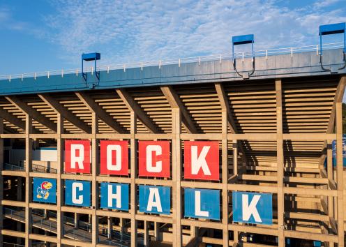 Rock Chalk banners on the outside of Memorial Stadium